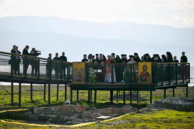 Pope Leo XIV and and Patriarch Bartholomew I of Constantinople attend an ecumenical prayer service near the sunken Byzantine Basilica of Saint Neophytos by Lake Iznik, on November 28, 2025. Pope Leo XIV is on a four-day visit to Turkey. (Photo by OZAN KOSE / AFP)