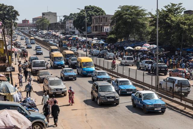Vehicles drive past a market in Bissau, on November 28, 2025. Life limped back to normal on Friday in the capital of volatile Guinea-Bissau after the west African nation's fifth coup that came on the heels of presidential and parliamentary polls.
The military appointed General Horta N'Tam, the army's chief of staff, as the country's new leader for a transition period of one year after Wednesday's putsch. The takeover came just one day before authorities had been due to announce the provisional results of the November 23 polls. There were vehicles and taxis along the main road from the port of the seaside capital Bissau to the presidential palace, as well as pedestrians (Photo by PATRICK MEINHARDT / AFP)