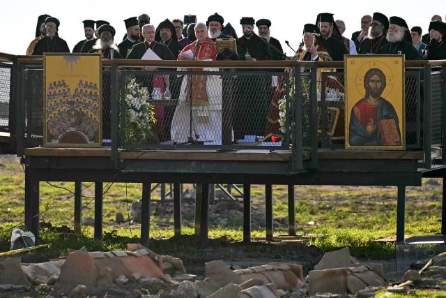 Pope Leo XIV and Patriarch Bartholomew I of Constantinople attend an ecumenical prayer service near the sunken Byzantine Basilica of Saint Neophytos by Lake Iznik, on November 28, 2025. Pope Leo XIV is on a four-day visit to Turkey. (Photo by OZAN KOSE / AFP)