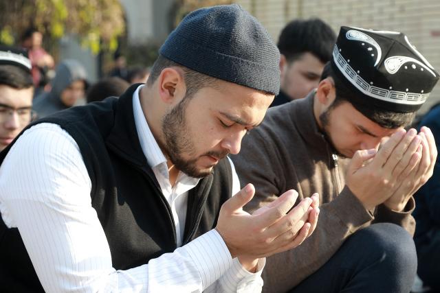 Uzbek Muslims perform a prayer for rain outside a mosque in Tashkent on November 28, 2025. Uzbek Muslims held mass prayers on November 28, 2025, calling for more rain in the Central Asian country suffering severe droughts associated with climate change. (Photo by Temur ISMAILOV / AFP)