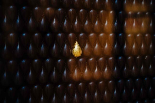 This photograph taken on November 28, 2025 in Paris shows a chocolate pastry made by rance's pastry chef Jerome de Oliveira displayed three days ahead of an auction of 25 grands chefs pastries for the benefit of the BAB Charity association, which works for the well-being and development of children with leukaemia who are hospitalised at the Armand Trousseau Hospital in Paris.

"25 pastry chefs commit to helping children", at Artcurial auction house in Paris. (Photo by Dimitar DILKOFF / AFP)