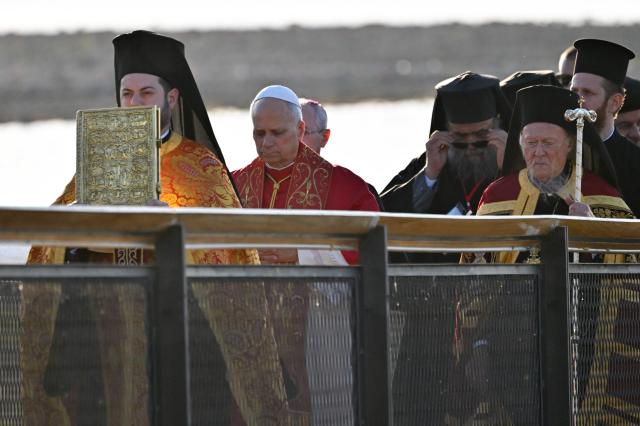 Pope Leo XIV and Patriarch Bartholomew I of Constantinople attend an ecumenical prayer service near the sunken Byzantine Basilica of Saint Neophytos by Lake Iznik, on November 28, 2025. (Photo by Andreas SOLARO / AFP)