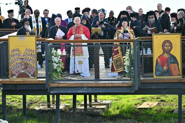 Pope Leo XIV and Patriarch Bartholomew I of Constantinople attend an ecumenical prayer service near the sunken Byzantine Basilica of Saint Neophytos by Lake Iznik, on November 28, 2025. Pope Leo XIV is on a four-day visit to Turkey. (Photo by Andreas SOLARO / AFP)
