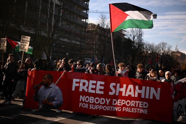 Protesters hold a banner “Free Mohamed Shahin”, one of the Imam of Turin detained in Italy, during a nationwide strike organized by the Unione Sindacale di Base (USB Union), in Turin on November 28, 2025. Trade unions have called a strike for public and private sector workers, affecting transport, schools, healthcare, and other public services. The reasons behind the strike are linked to the 2026 Economic Plan, which is being contested by the union groups CUB, USB, SGB, COBAS, and USI-CIT, who oppose the increase in military spending at the expense of essential public services. (Photo by MARCO BERTORELLO / AFP)