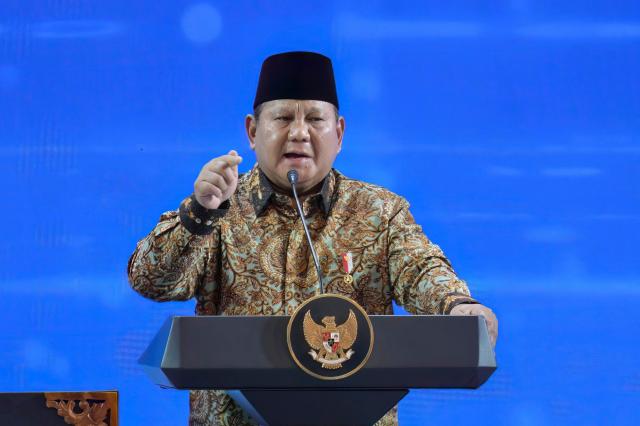 Indonesian President Prabowo Subianto speaks during an annual meeting of Bank Indonesia (Indonesia's Central Bank) in Jakarta on November 28, 2025. (Photo by BAY ISMOYO / AFP)
