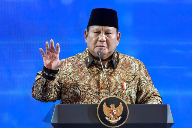 Indonesian President Prabowo Subianto speaks during an annual meeting of Bank Indonesia (Indonesia's Central Bank) in Jakarta on November 28, 2025. (Photo by BAY ISMOYO / AFP)