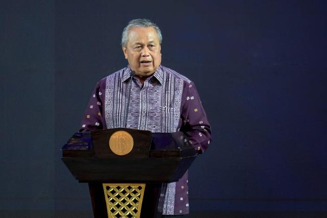 Governor of Bank Indonesia (Indonesia's Central Bank) Perry Warjiyo presents his paper on monetary policy during an annual meeting in Jakarta on November 28, 2025. (Photo by BAY ISMOYO / AFP)