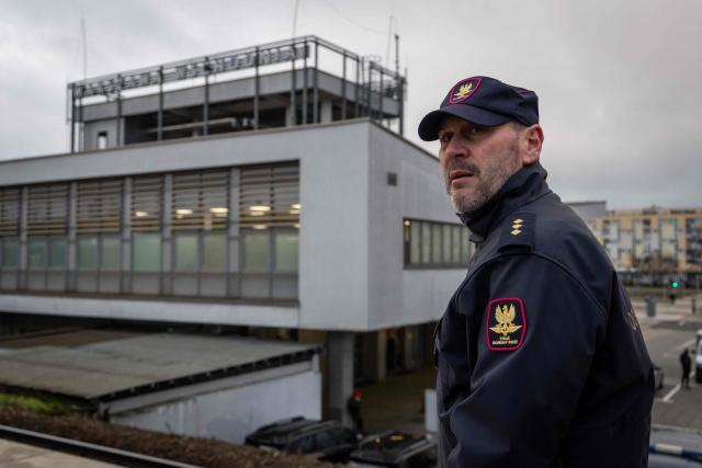 Pawel Kuskowski, the spokesman of the Railway Security Guard looks on during an AFP interview at the Eastern railway station in Warsaw, Poland, on November 27, 2025. The patrol is a part of "Operation Horizon," an effort launched by Poland earlier this month designed to boost rail security and protect critical infrastructure, following a series of diversions, which officials blame on Russia. (Photo by Wojtek RADWANSKI / AFP)