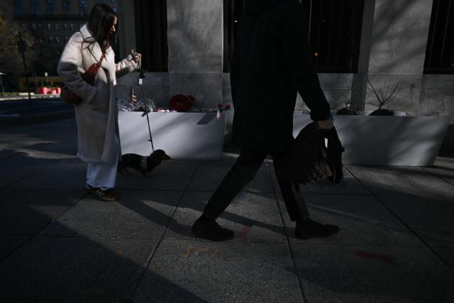 A makeshift memorial has been set up in honor of the two National Guard service members shot near the Farragut West Metro Station in Washington, DC on November 28, 2025, two days after a shooting killed one National Guard member and critically wounded another. Two National Guard troops were shot on November 26 near the White House in what authorities described as a targeted attack by an Afghan migrant who had previously worked with the US military in Afghanistan, a case now being treated as a terrorism investigation, after President Donald Trump said on November 27 that one of the soldiers, Sarah Beckstrom, had died and the other was fighting for his life. (Photo by Brendan SMIALOWSKI / AFP)