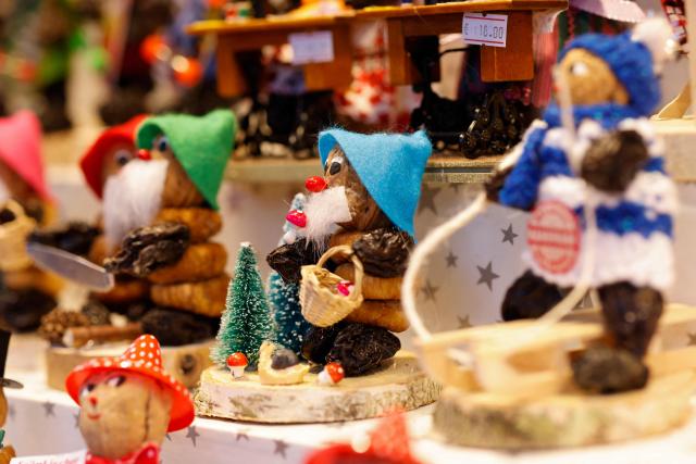 Traditional 'Nuernberger Zwetschgenmaennla' (made from dried plums, fruits and nuts) are diplayed at a stall at the Christmas market prior to its official opening in Nuremberg, Germany on November 28, 2025.  (Photo by Alexandra BEIER / AFP)