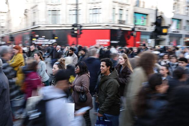 Shoppers in the crowds in central London on November 28, 2025, during the Black Friday discounted sales (Photo by HENRY NICHOLLS / AFP)