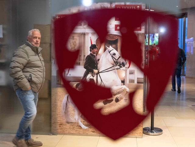 The logo of the famous 460 years old Spanish Riding School is seen on its glass door in Vienna, Austria on November 26, 2025. Austria is probing Vienna's Spanish Riding School after claims that the famed school mistreated some of its Lipizzaner horses, the government said on November 25, 2025. It is the latest headache to hit the classical dressage institution whose managing director was let go in September over alleged expense irregularities. Public broadcaster ORF reported late November 24, 2025 that employees described mistreatment of young horses in a 2023 internal survey. (Photo by Joe Klamar / AFP)