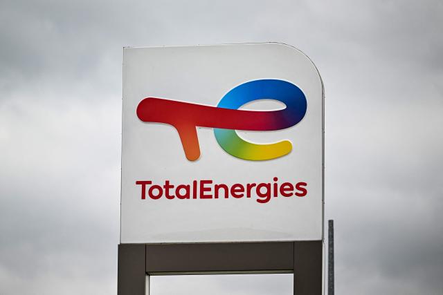 (FILES) This photograph shows a logo of Total Energies at a gas station in Genech, northern France on October 5, 2022. Seven people will go on trial on December 1, 2025 before the Nanterre Criminal Court, outside Paris, for attempted fraud and corruption against TotalEnergies. (Photo by Sameer Al-DOUMY / AFP)