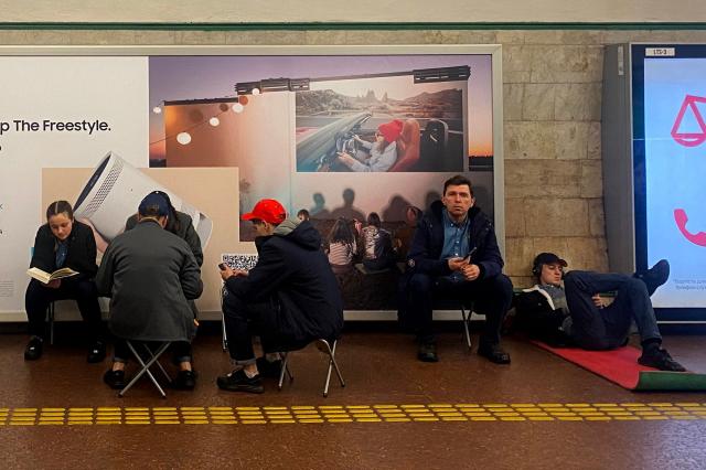 People take shelter at a metro station during an air raid alert in Kyiv, on November 28, 2025, amid the Russian invasion of Ukraine. (Photo by Ania TSOUKANOVA / AFP)