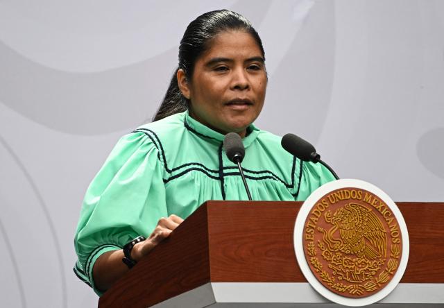 Tarahumara ethnic long-distance and ultramarathon runner Maria Lorena Ramirez delivers a speech before receiving the National Sports Award during a ceremony at the National Palace in Mexico City on November 28, 2025. (Photo by Yuri CORTEZ / AFP)