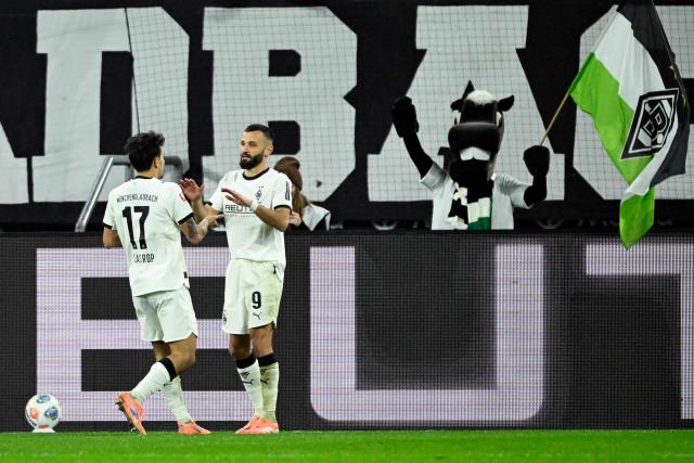 Moenchengladbach's French midfielder #09 Franck Honorat (R) celebrates with Moenchengladbach's German-South Korean midfielder #17 Jens Castrop after scoring a goal which was disallowed for offside during the German first division Bundesliga football match between Borussia Moenchengladbach and RB Leipzig in Moenchengladbach, western Germany on November 28, 2025. (Photo by INA FASSBENDER / AFP) / DFL REGULATIONS PROHIBIT ANY USE OF PHOTOGRAPHS AS IMAGE SEQUENCES AND/OR QUASI-VIDEO