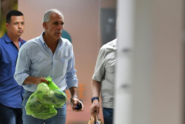 Honduran presidential candidate and businessman Nasry Asfura of the opposition National Party leaves after a meeting with business leaders in Tegucigalpa on November 28, 2025. Asfura told AFP that he has "no connection whatsoever" with former president Juan Orlando Hernandez, who is imprisoned in the United States on drug trafficking charges and was pardoned on Friday by President Donald Trump. (Photo by Orlando SIERRA / AFP)