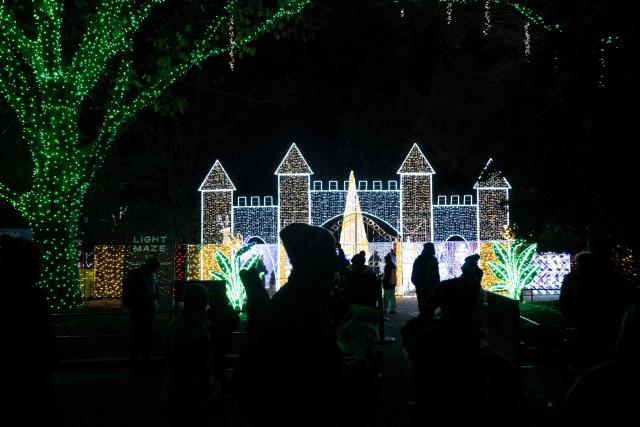 People visit the Smithsonian National Zoo during their holiday zoo lights exhibit November 28, 2025, in Washington, DC. (Photo by Brendan Smialowski / AFP)