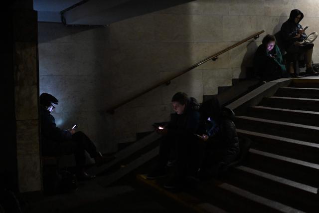 People take shelter at a metro station during an air attack in Kyiv on November 29, 2025, amid the Russian invasion of Ukraine. Loud explosions were heard in the Ukrainian capital Kyiv early on November 29, 2025, the mayor and AFP journalists said. (Photo by Sergei GAPON / AFP)