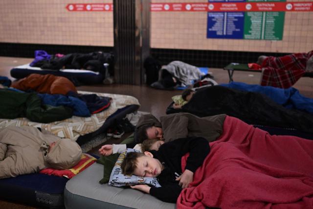 People take shelter at a metro station during an air attack in Kyiv on November 29, 2025, amid the Russian invasion of Ukraine. Loud explosions were heard in the Ukrainian capital Kyiv early on November 29, 2025, the mayor and AFP journalists said. (Photo by Sergei GAPON / AFP)