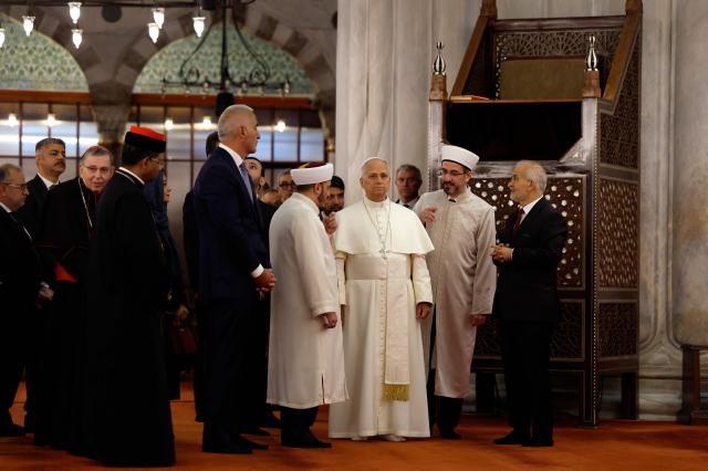 Pope Leo XIV visits the Sultan Ahmed Mosche (Blue Mosche), in Istanbul on November 29, 2025. (Photo by BERK OZKAN / AFP)