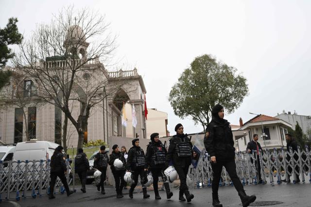 Turkish female police members take position prior the arrival of Pope Leo XIV for a private meeting with religious leaders at the Mor Ephrem Syriac Orthodox Church, in Istanbul on November 29, 2025. (Photo by YASIN AKGUL / AFP)