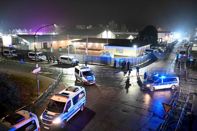 Police cars stand early morning around the fair ground prior to a two-day convention of far-right Alternative for Germany (AfD) party to establish its new youth organisation at the exhibition halls in Giessen, western Germany, on November 29, 2025. During the convention, Germany's AfD plans to establish its new youth organisation, to draft the organisation's statutes and elect its new leadership. The AfD's former youth organisation, Junge Alternative (Young Alternative), dissolved in spring 2025 after the party separated from it. Massive counter-protests from politicians and civil society have already been announced. The city announced that it intended to cordon off the entire area around the AfD event venue due to police security concerns. The anti-AfD protests are to be moved to the other side of the Lahn River. (Photo by Kirill KUDRYAVTSEV / AFP)