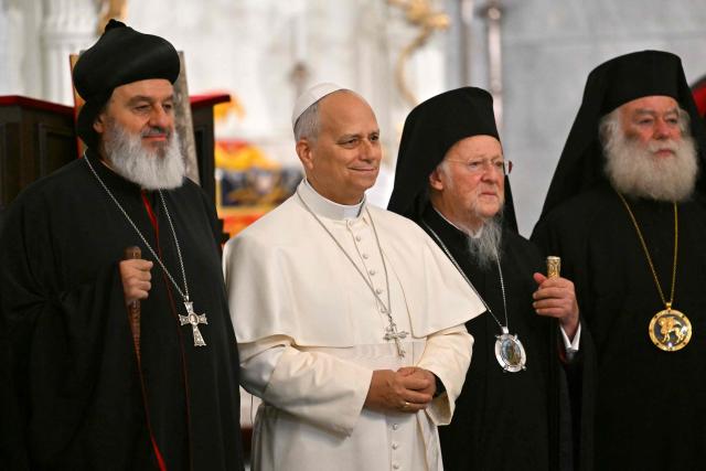 Pope Leo XIV stands with patriarch Mor Ignatius Aphrem II (L) and patriarch Bortholomew I as he arrives for a private meeting with religious leaders at the Mor Ephrem Syriac Orthodox Church, in Istanbul on November 29, 2025. (Photo by Andreas SOLARO / AFP)