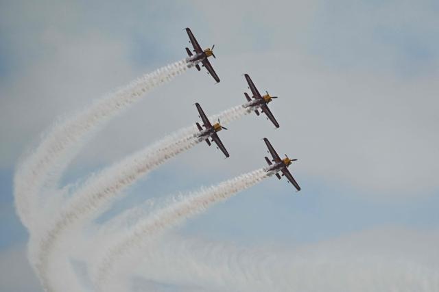 The Marksmen aerobatic team from South Africa performs during the Aero Asia 2025 in Zhuhai, in southern China's Guangdong province on November 29, 2025. Aero Asia 2025 is an international aviation and aerospace exhibition that runs between November 27 and 30. (Photo by Hector RETAMAL / AFP)