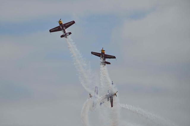 The Marksmen aerobatic team from South Africa performs during the Aero Asia 2025 in Zhuhai, in southern China's Guangdong province on November 29, 2025. Aero Asia 2025 is an international aviation and aerospace exhibition that runs between November 27 and 30. (Photo by Hector RETAMAL / AFP)