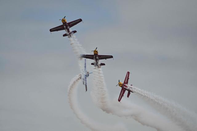 The Marksmen aerobatic team from South Africa performs during the Aero Asia 2025 in Zhuhai, in southern China's Guangdong province on November 29, 2025. Aero Asia 2025 is an international aviation and aerospace exhibition that runs between November 27 and 30. (Photo by Hector RETAMAL / AFP)
