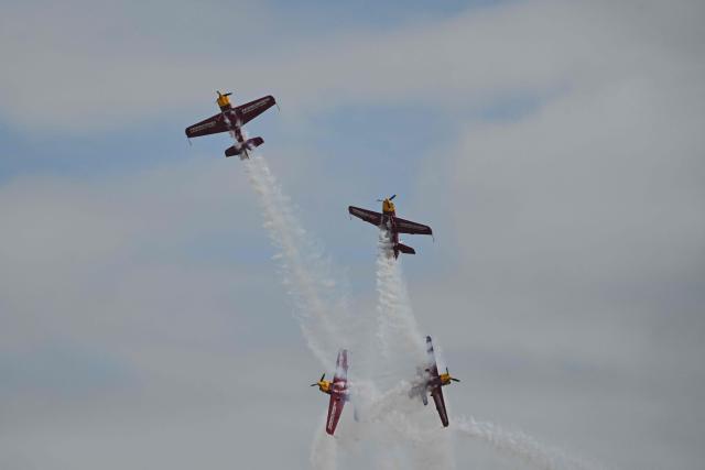 The Marksmen aerobatic team from South Africa performs during the Aero Asia 2025 in Zhuhai, in southern China's Guangdong province on November 29, 2025. Aero Asia 2025 is an international aviation and aerospace exhibition that runs between November 27 and 30. (Photo by Hector RETAMAL / AFP)