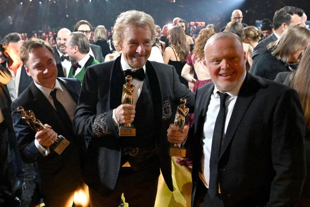 German comedian and actor Michael Herbig (L), German host and entertainer Thomas Gottschalk (C) and German host and entertainer Stefan Raab pose with their trophies during the award ceremony of the Kurier Romy Gala in Kitzbühel, Austria on November 28, 2025. (Photo by BARBARA GINDL / APA / AFP) / Austria OUT