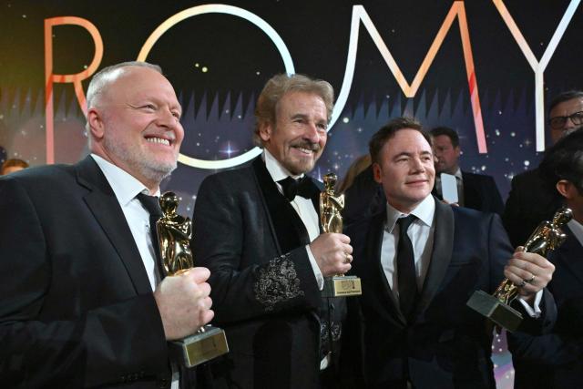 German host and entertainer Stefan Raab (L), German host and entertainer Thomas Gottschalk (C) and German comedian and actor Michael Herbig pose with their trophies during the award ceremony of the Kurier Romy Gala in Kitzbühel, Austria on November 28, 2025. (Photo by BARBARA GINDL / APA / AFP) / Austria OUT