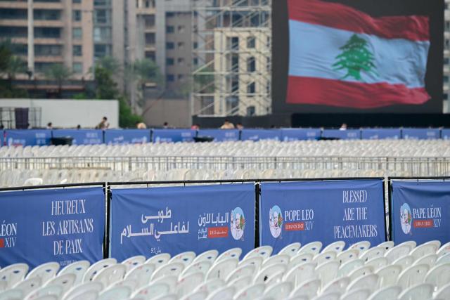 This picture shows lines of plastic chairs in preparation for a mass on the waterfront in Beirut on November 29, 2025, ahead of Pope Leo XIV's visit to Lebanon. Leo is due to arrive in Lebanon on November 30 for a three-day trip that includes an open-air mass at Beirut's waterfront that organisers expect to draw 120,000 people, as well as an interreligious meeting in the city centre. (Photo by Giuseppe CACACE / AFP)