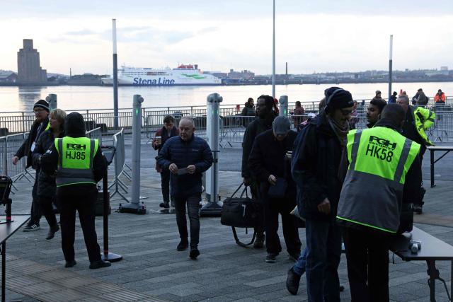 Delegates pass through security checks as they arrive on the first day of the Founding Conference for Your Party in Liverpool, north-west England, on November 29, 2025. A new UK political party involving veteran socialist Jeremy Corbyn opens its inaugural conference Saturday, seeking to move on from a messy launch and become a viable left-wing challenger to Labour. (Photo by Darren Staples / AFP)