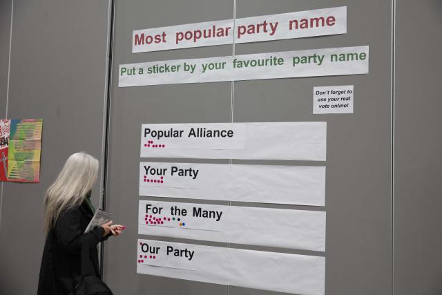 A delegate indicates a favoured party name on the first day of the Founding Conference for Your Party in Liverpool, north-west England, on November 29, 2025. A new UK political party involving veteran socialist Jeremy Corbyn opens its inaugural conference Saturday, seeking to move on from a messy launch and become a viable left-wing challenger to Labour. (Photo by Darren Staples / AFP)