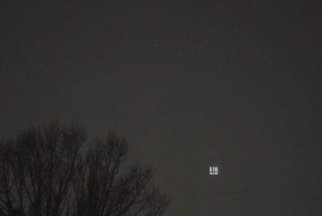 A single lighted window is seen in a multi storey residential building in Kyiv during heavy fog and blackout hours on November 29, 2025, following Russian missiles and drones attack to Ukrainian energy infrastructure, amid Russian invasion in Ukraine. A series of Russian missile and drone strikes on Ukraine that began late on November 28, 2025 and lasted into early November 29, 2025 left more than 600,000 people without power, Ukraine's energy ministry said. (Photo by Sergei SUPINSKY / AFP)