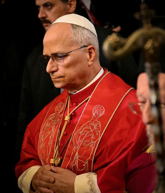 Pope Leo XIV (L) and Patriarch Bartholomew I (R) arrive for the doxology at the Patriarchal Church of Saint George, in Istanbul on November 29, 2025. (Photo by OZAN KOSE / AFP)
