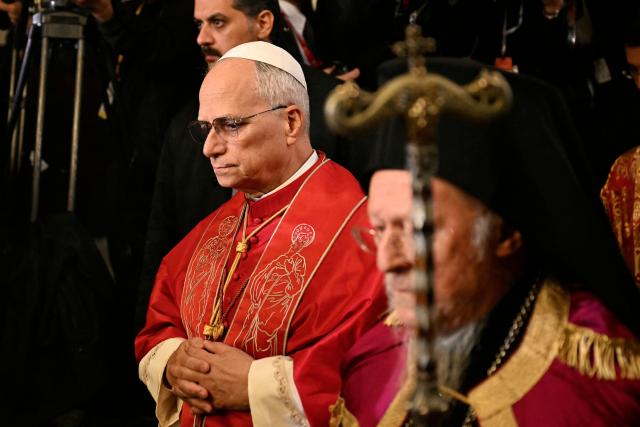 Pope Leo XIV (L) and Patriarch Bartholomew I (R) arrive for the doxology at the Patriarchal Church of Saint George, in Istanbul on November 29, 2025. (Photo by OZAN KOSE / AFP)