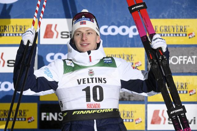 Third placed Norway's Ansgar Evensen celebrates on the podium after the men's cross country classic skiing sprint final at the FIS World Cup Ruka Nordic in Kuusamo, Finland, on November 29, 2025. (Photo by Vesa Moilanen / Lehtikuva / AFP) / Finland OUT