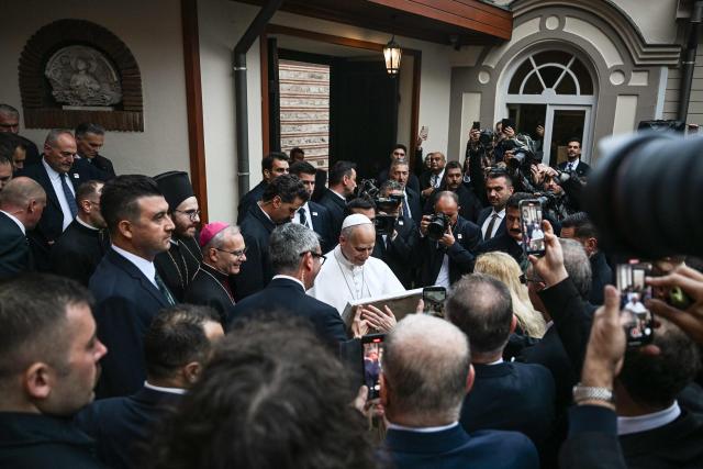 Pope Leo XIV (C) leaves after attending a doxology ceremony at the Patriarchal Church of Saint George, in Istanbul on November 29, 2025. (Photo by Ozan KOSE / AFP)