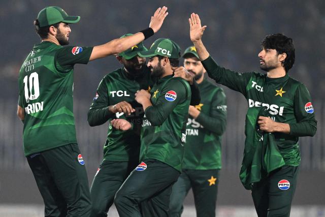 Pakistan's Abrar Ahmed (R) celebrates with teammates after taking the wicket of Sri Lanka's Pavan Rathnayake during the Twenty20 international Tri-Series final cricket match between Pakistan and Sri Lanka at the Rawalpindi Cricket Stadium in Rawalpindi on November 29, 2025. (Photo by Aamir QURESHI / AFP)