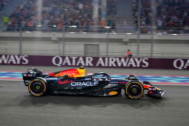 Red Bull Racing's Japanese driver Yuki Tsunoda drives during the sprint race ahead of the Formula One Qatar Grand Prix at the Lusail International Circuit in Lusail on November 29, 2025. (Photo by Altaf Qadri / POOL / AFP)
