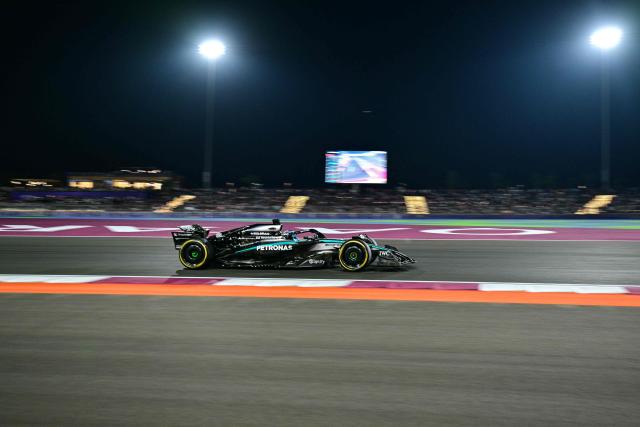 TOPSHOT - Mercedes' British driver George Russell drives during the sprint race ahead of the Formula One Qatar Grand Prix at the Lusail International Circuit in Lusail on November 29, 2025. (Photo by Andrej ISAKOVIC / AFP)