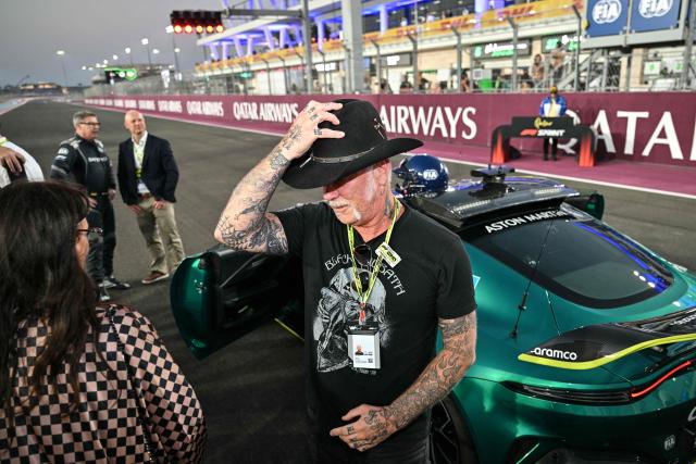 Metallica's James Hatfield walks on the grid before the sprint race ahead of the Formula One Qatar Grand Prix at the Lusail International Circuit in Lusail on November 29, 2025. (Photo by Andrej ISAKOVIC / AFP)
