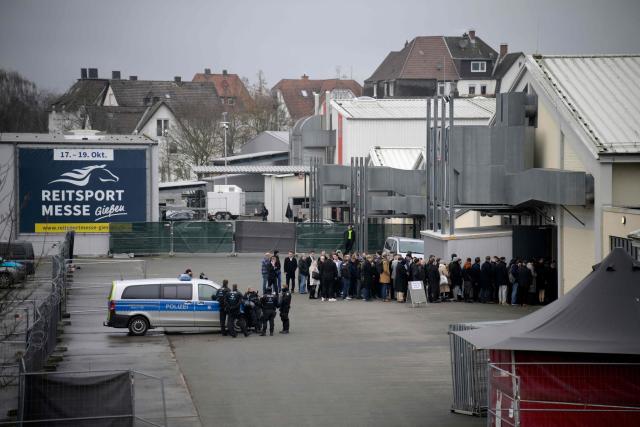 Delegates queue outside to enter the venue for a two-day convention of far-right Alternative for Germany (AfD) party to establish its new youth organisation at the exhibition halls in Giessen, western Germany, on November 29, 2025. (Photo by Sascha Schuermann / AFP)