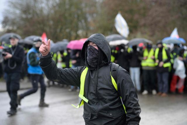 A protestor reacts near the venue of a two-day convention of far-right Alternative for Germany (AfD) party to establish its new youth organisation in Giessen, western Germany, on November 29, 2025. (Photo by Sascha Schuermann / AFP)