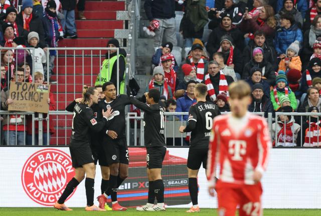 (3rd L) St Pauli's Beninese forward #27 Andreas Hountondji celebrates his 0-1 with team mates  during the German first division Bundesliga football match between FC Bayern Munich and FC St Pauli in Munich, southern Germany on November 29, 2025. (Photo by Alexandra BEIER / AFP) / DFL REGULATIONS PROHIBIT ANY USE OF PHOTOGRAPHS AS IMAGE SEQUENCES AND/OR QUASI-VIDEO