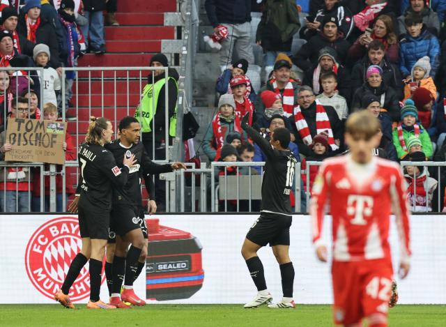 St Pauli's Beninese forward #27 Andreas Hountondji (2nd L) celebrates his 0-1 with team mates  during the German first division Bundesliga football match between FC Bayern Munich and FC St Pauli in Munich, southern Germany on November 29, 2025. (Photo by Alexandra BEIER / AFP) / DFL REGULATIONS PROHIBIT ANY USE OF PHOTOGRAPHS AS IMAGE SEQUENCES AND/OR QUASI-VIDEO